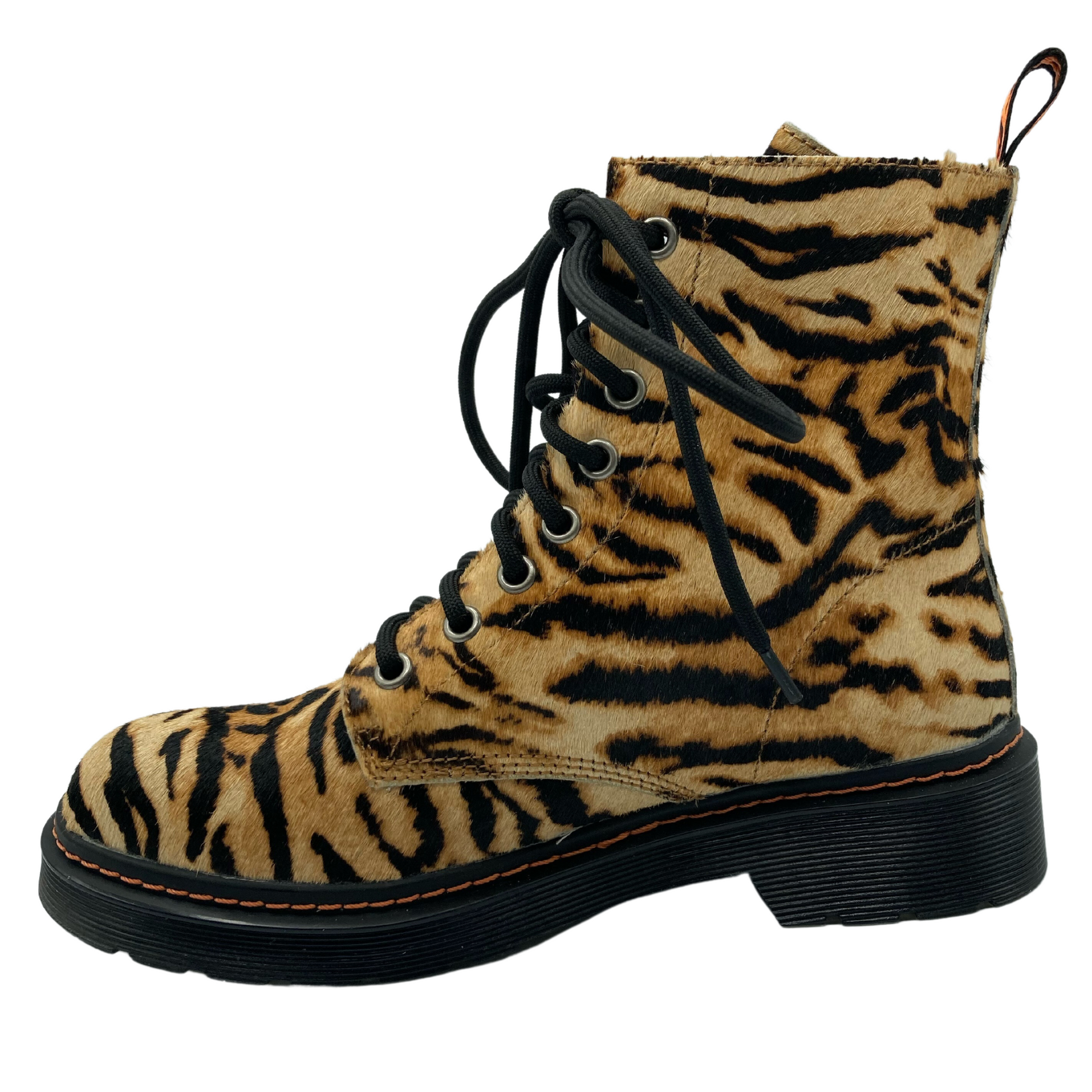 Left facing view of tiger print leather combat boot with black rubber outsole