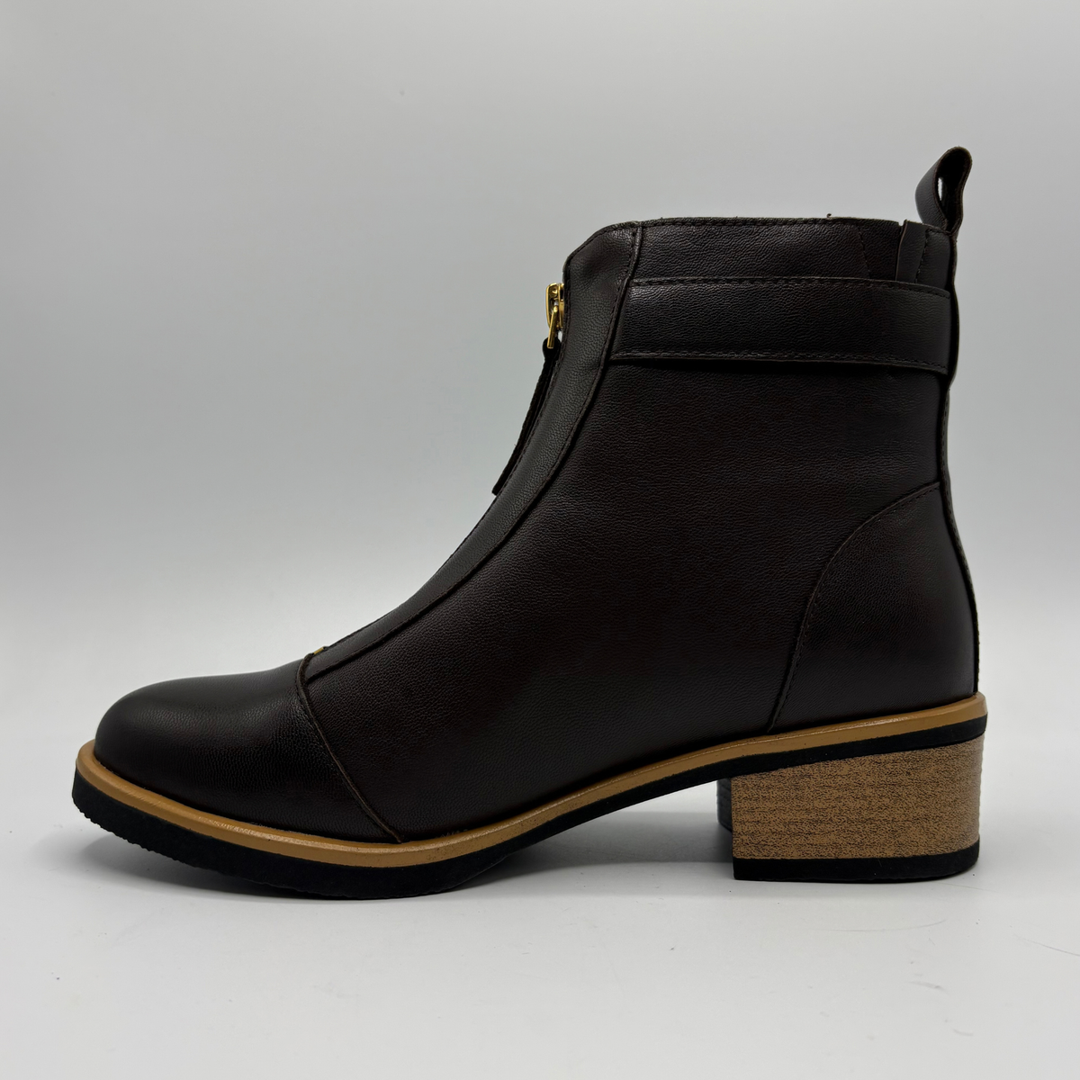 Left facing view of a leather short boot with a brown stacked heel