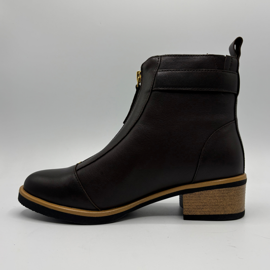 Left facing view of a leather short boot with a brown stacked heel