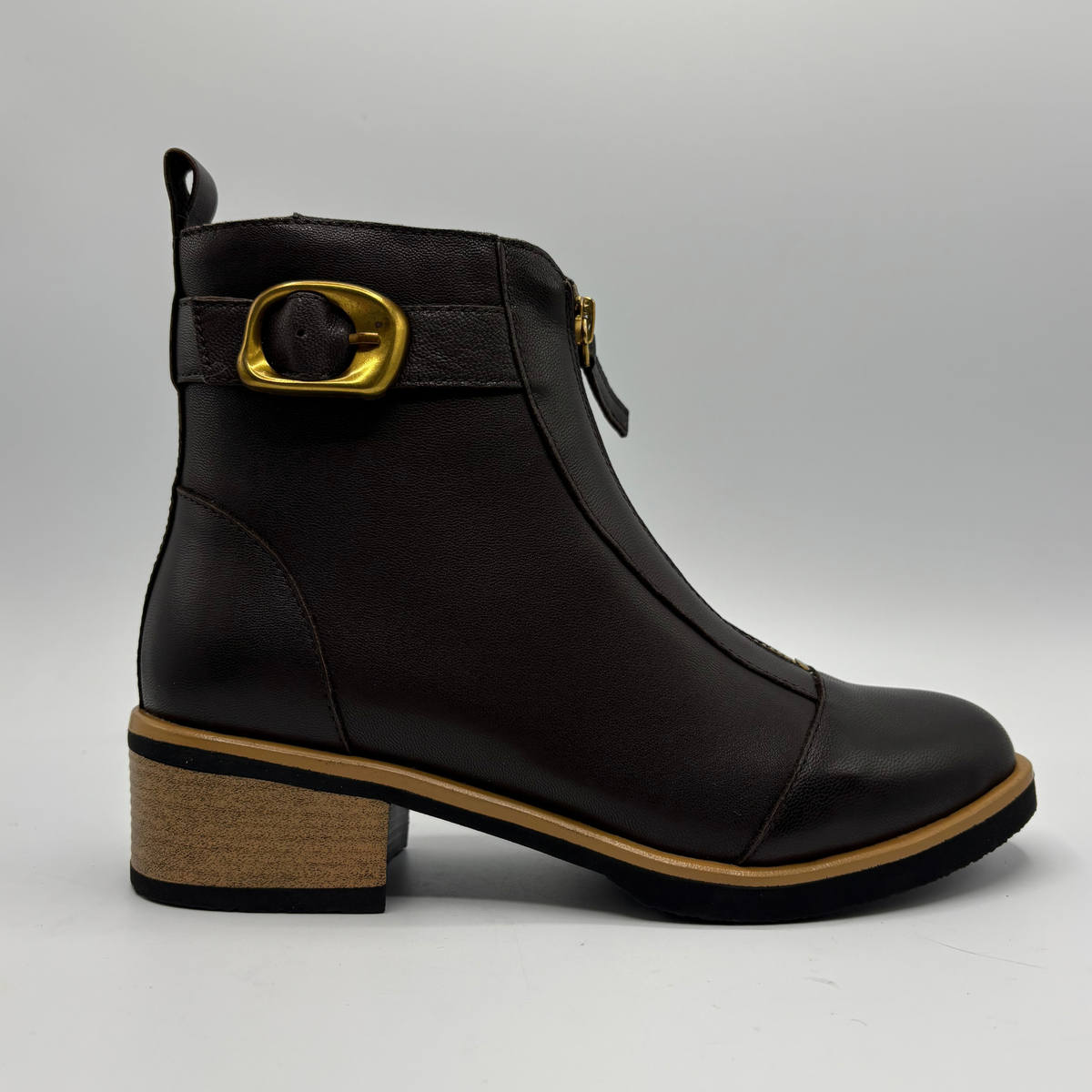 Right facing view of a leather short boot with a brown stacked heel