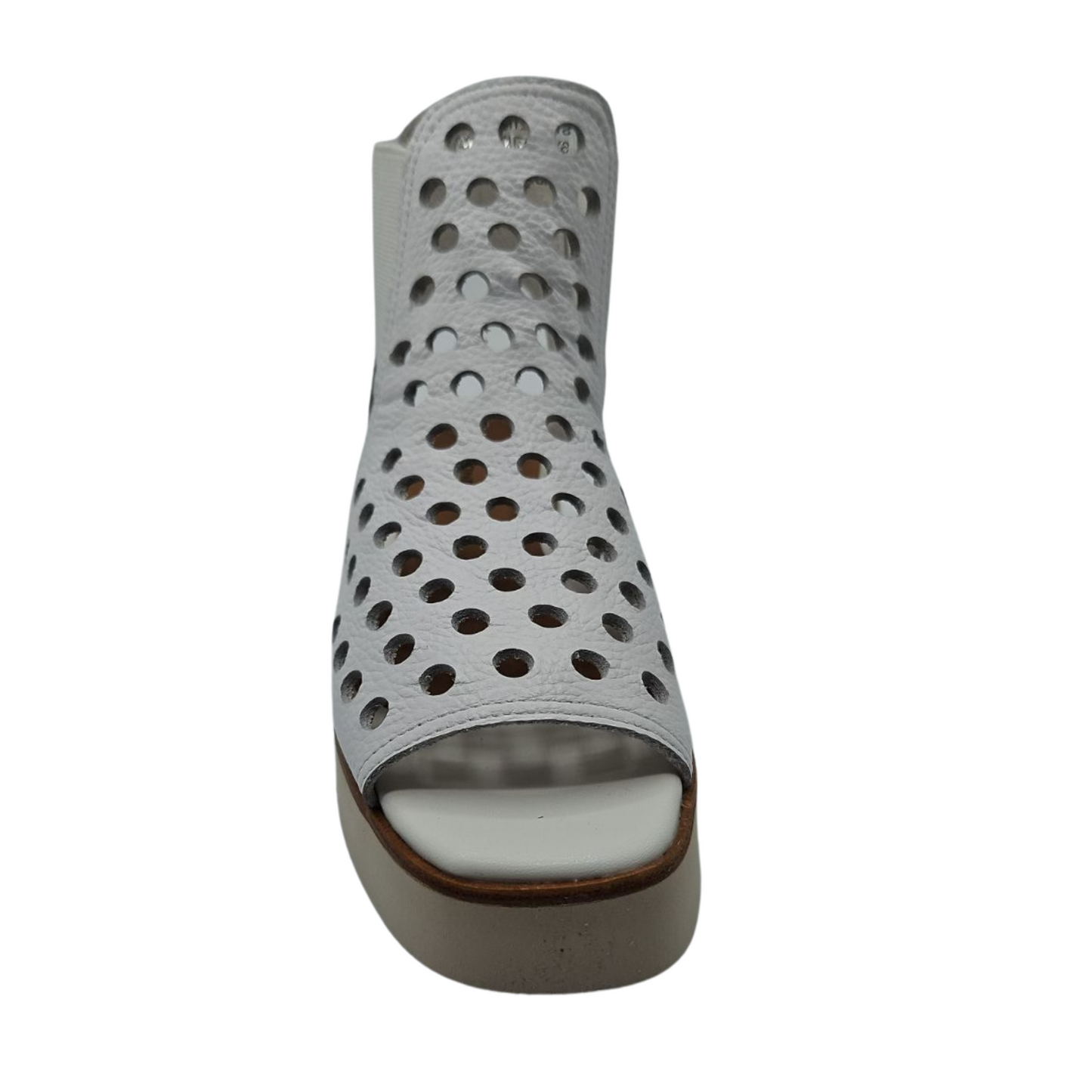 Front view of white perforated leather sandals with elastic sides and platform sole