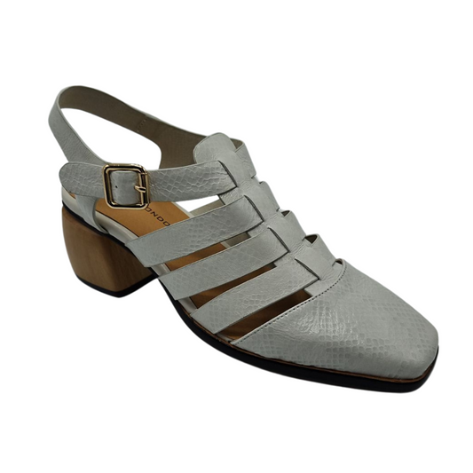 45 degree angled view of white leather sandal with closed toe, block heel, and gold buckle strap