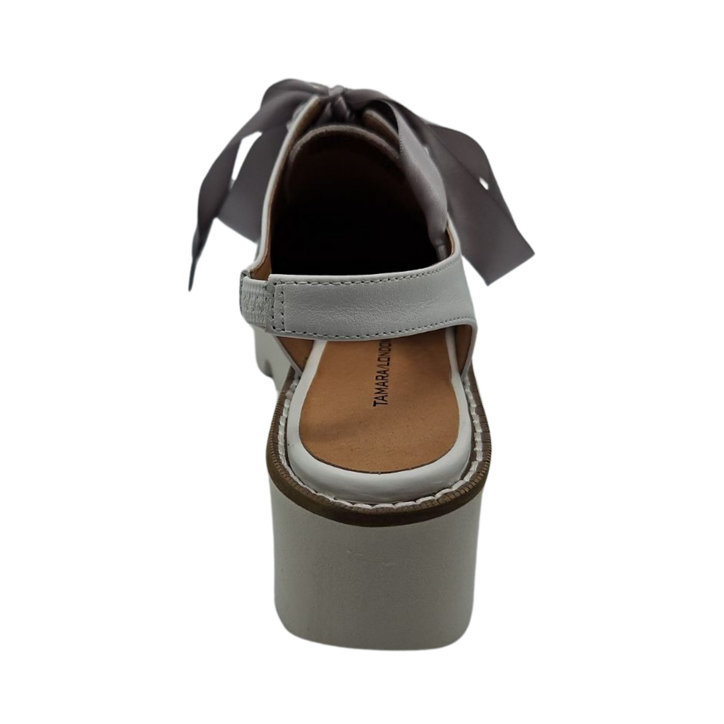 Back view of dove grey suede oxfords with shiny silver polka dots. Featuring satin ribbon laces, slingback strap and chunky white platform sole.