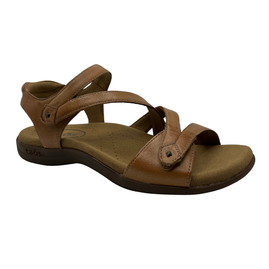 45 degree angled view of brown leather sandal with anatomical footbed, adjustable velcro straps and open toe