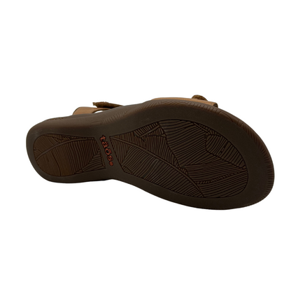 Bottom view of brown leather sandal with anatomical footbed, adjustable velcro straps and open toe