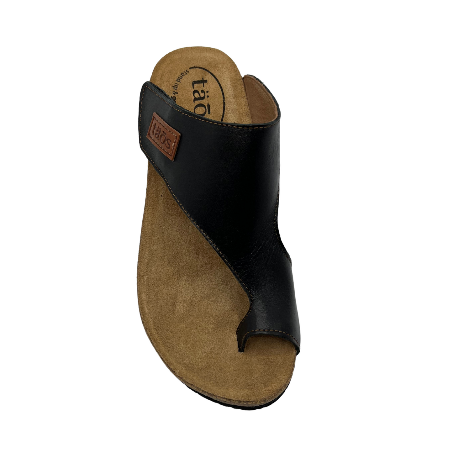Top view of black leather sandal with brown leather lined footbed. Hook and loop closure on strap and toe strap