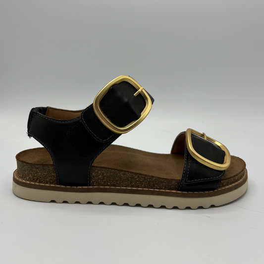 Right facing view of a black strapped sandal with gold buckles and a cork footbed