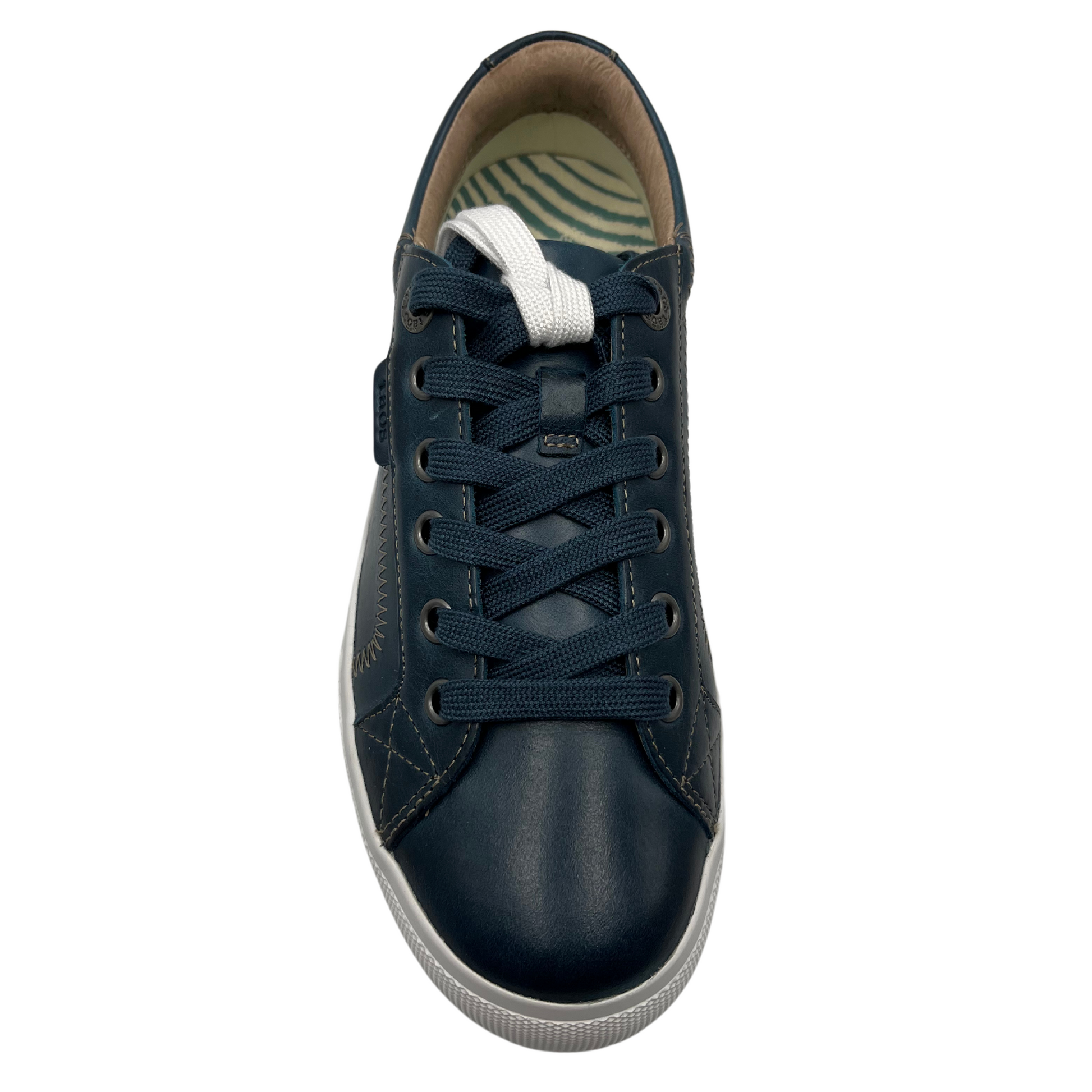 Top view of blue leather sneaker with white rubber outsole, matching laces and padded collar