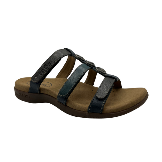 45 degree angled view of leather sandal with 3 straps and slip on style. Hook and loop closures on straps and lined anatomical footbed