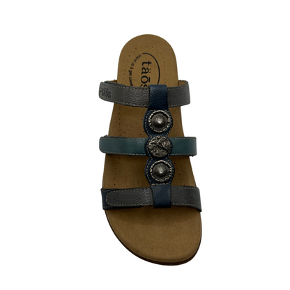 Top view of leather sandal with 3 straps and slip on style. Hook and loop closures on straps and lined anatomical footbed