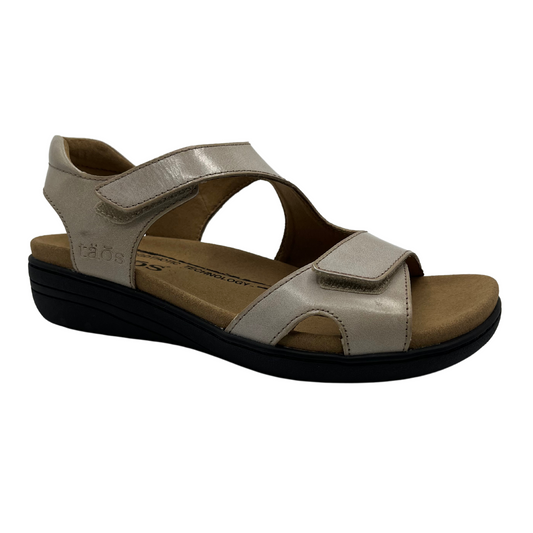 45 degree angled view of leather sandals with hook and loop closure straps, cushioned collar and leather lined footbed.