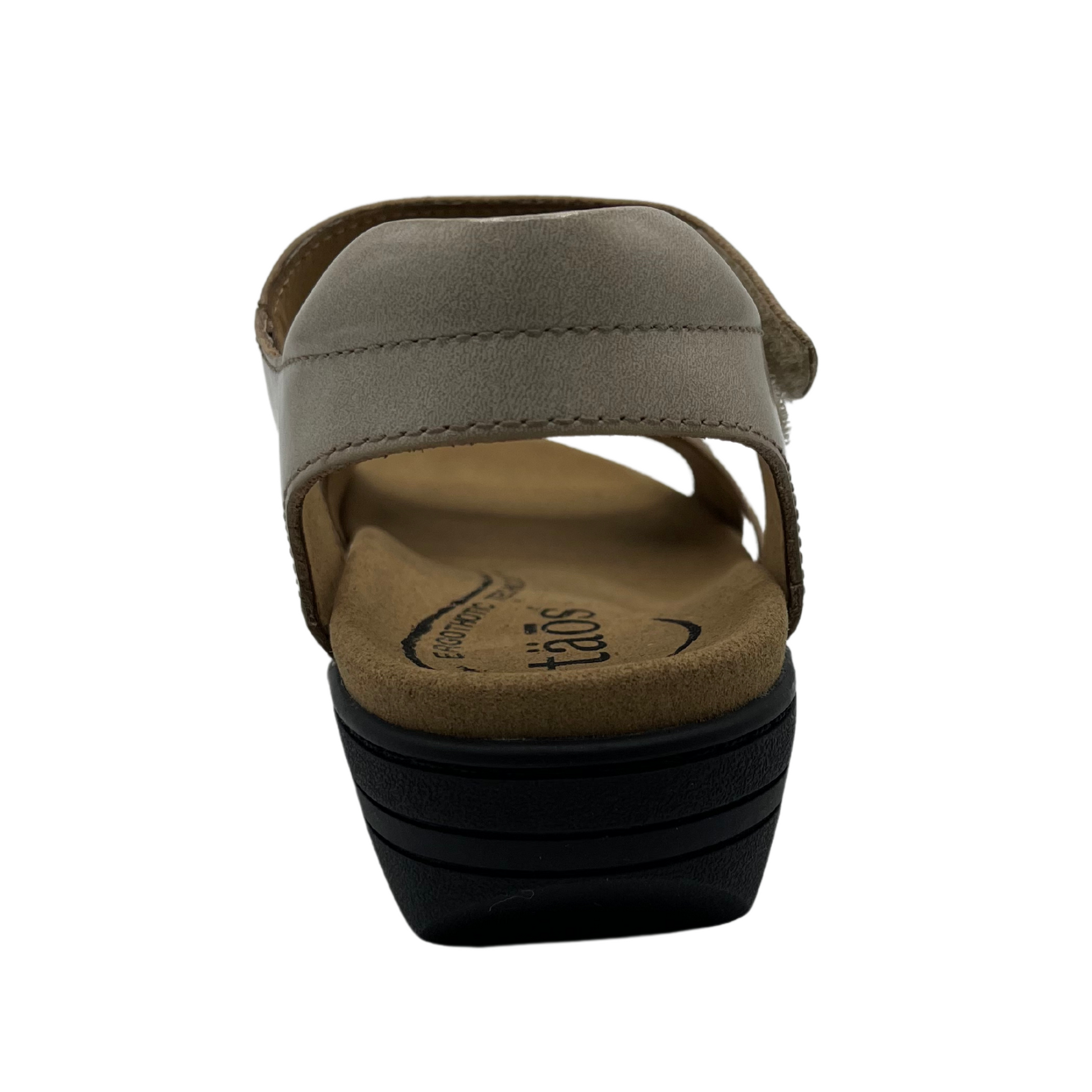 Back view of leather sandals with hook and loop closure straps, cushioned collar and leather lined footbed.