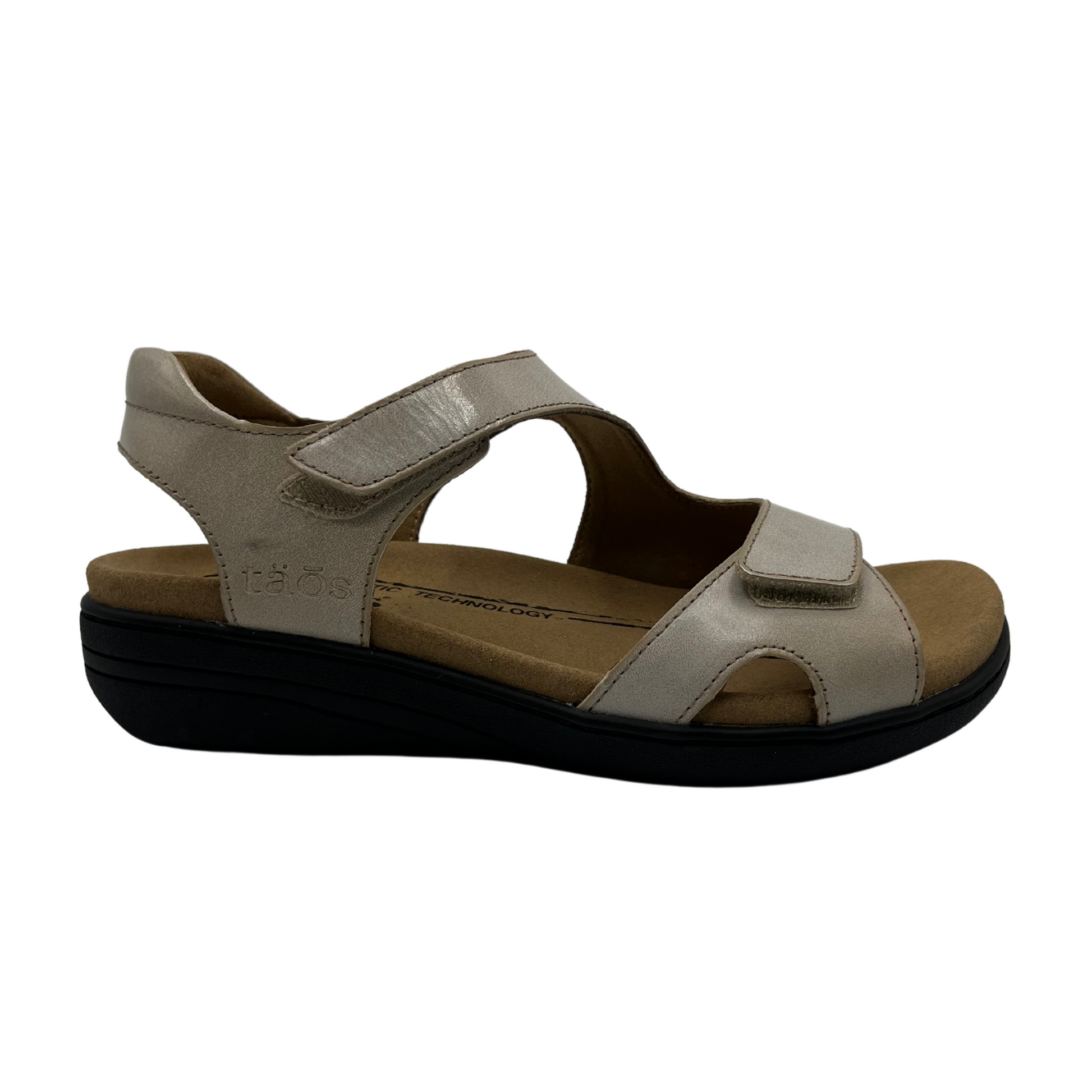 Right facing view of leather sandals with hook and loop closure straps, cushioned collar and leather lined footbed.