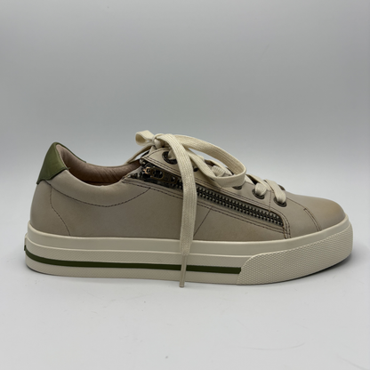 Beige sneaker with a zipper on a gray background