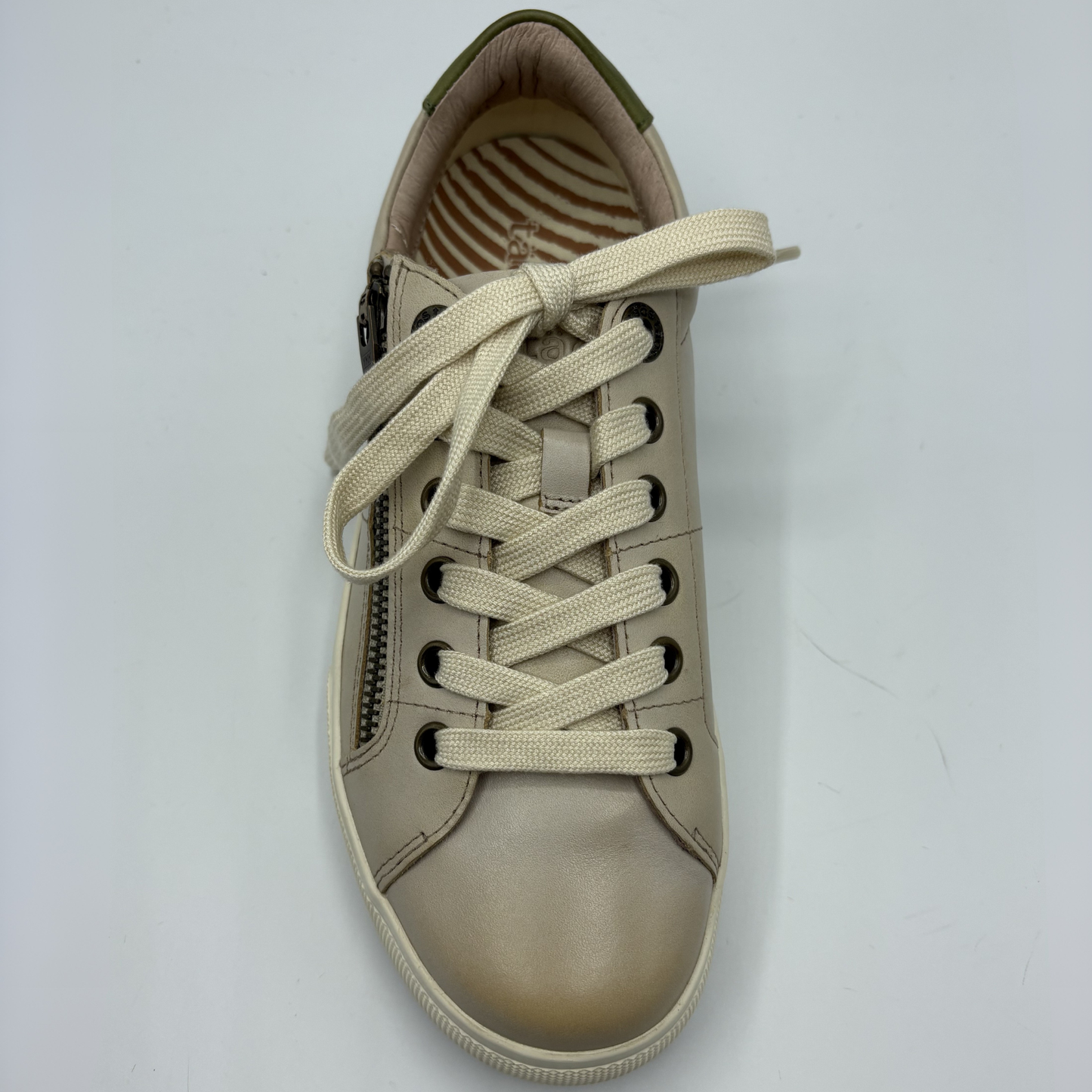 Beige sneaker with laces on a white background