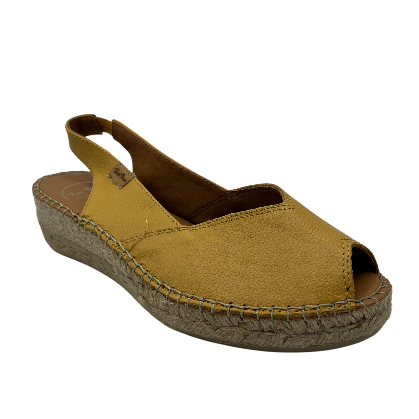 45 degree angled view of ocre coloured espadrille sandal with wedge heel and peep toe