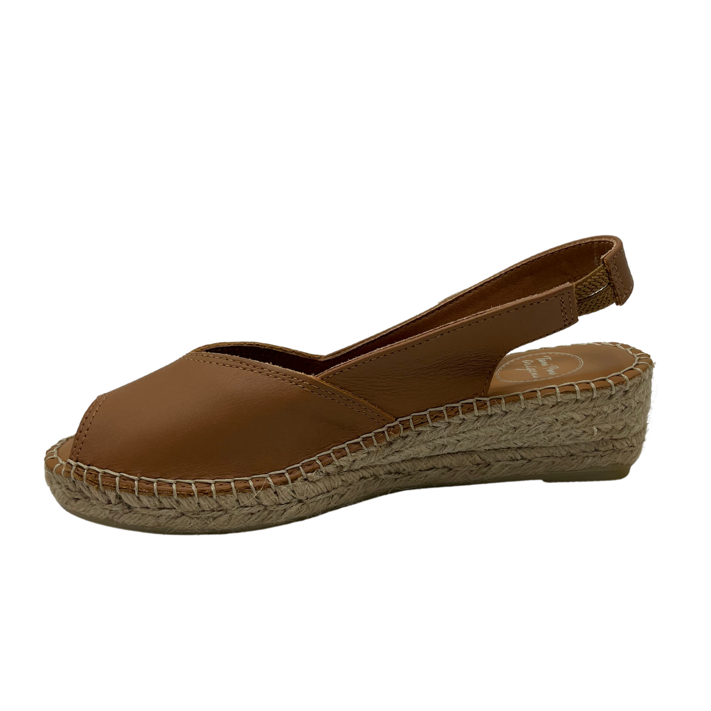 Left facing view of tan leather espadrille sandal with wedge heel and peep toe