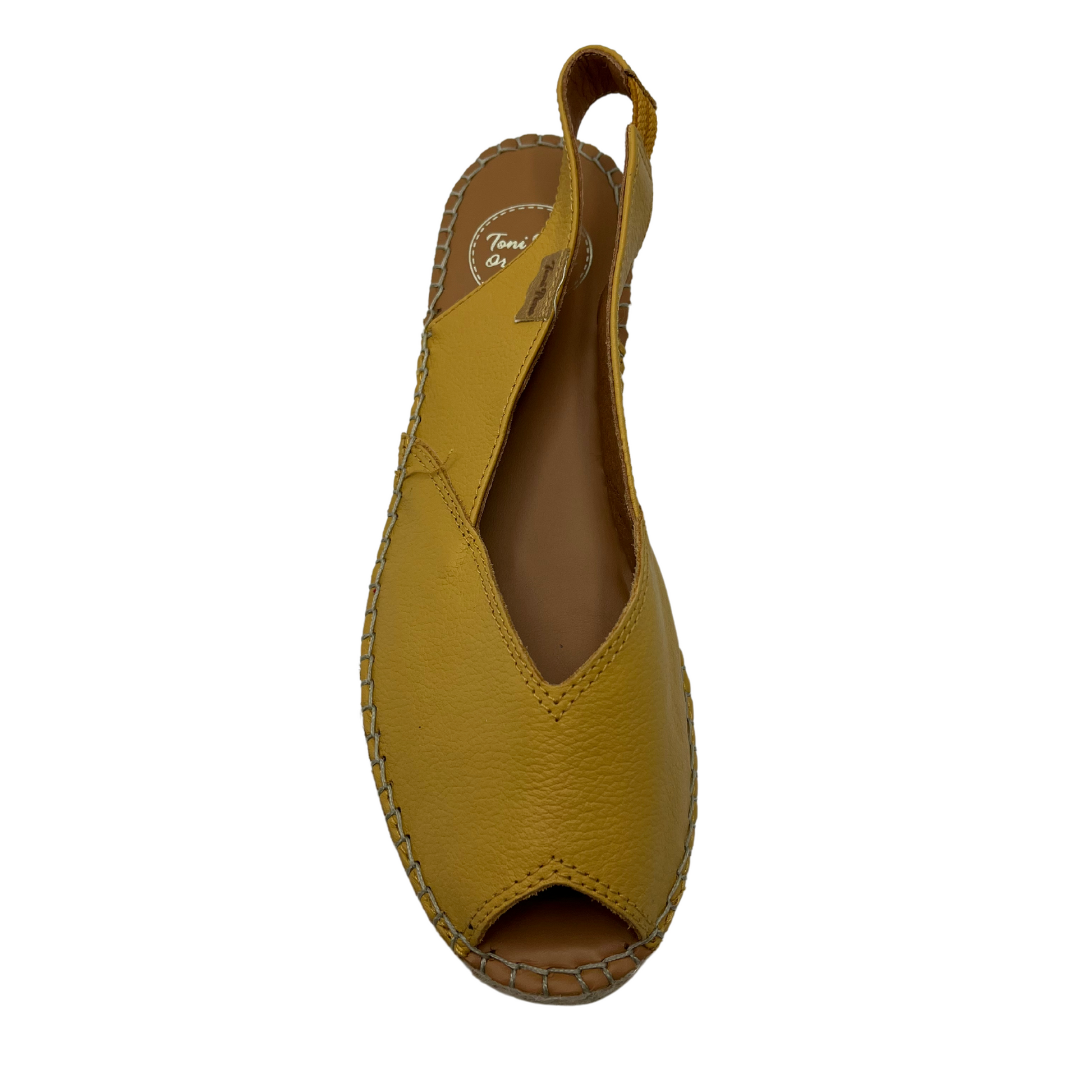 Top view of leather ocre coloured espadrille sandal with peep toe and slingback