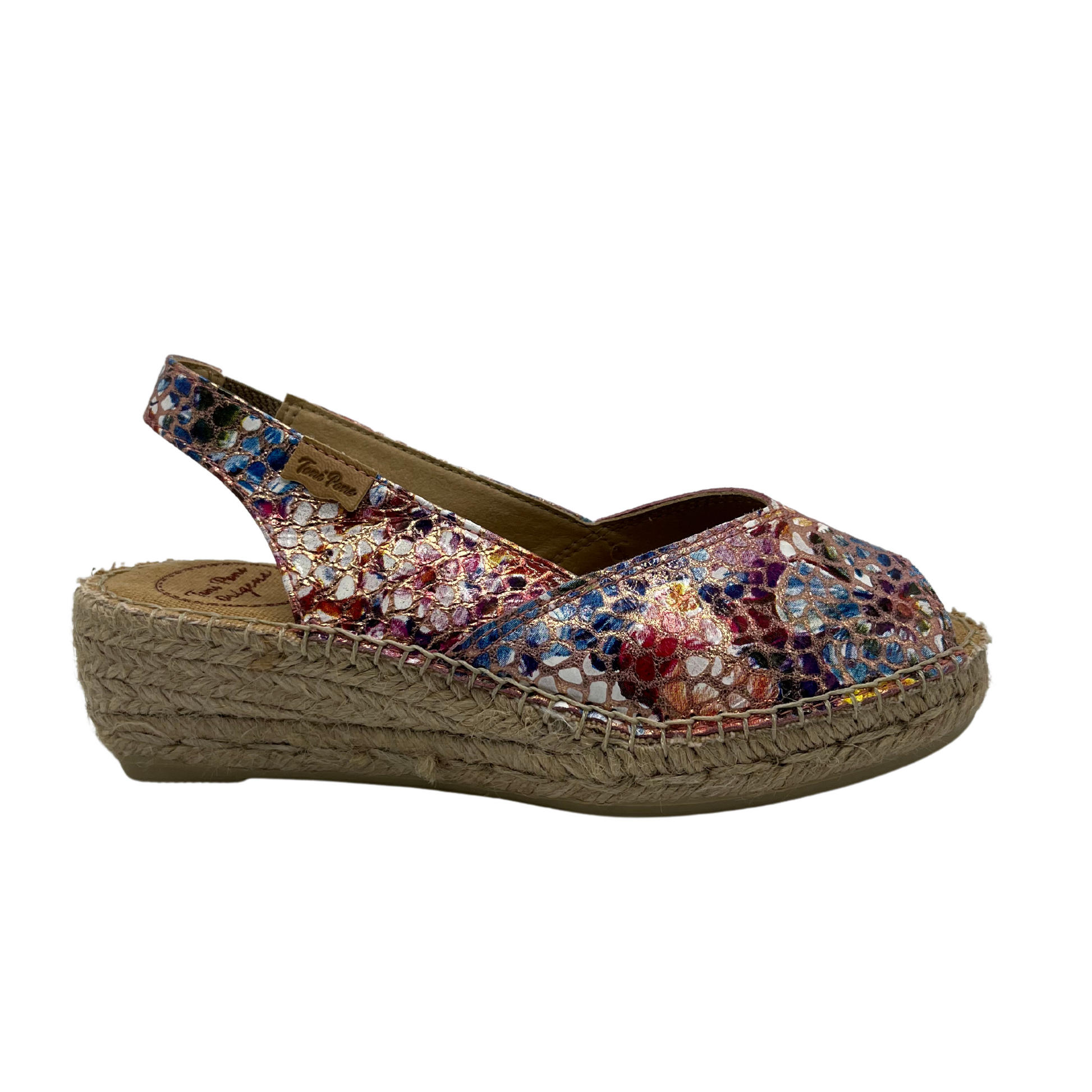 Right facing view of colourful leather upper espadrille shoe with sling back strap and slight wedge heel.