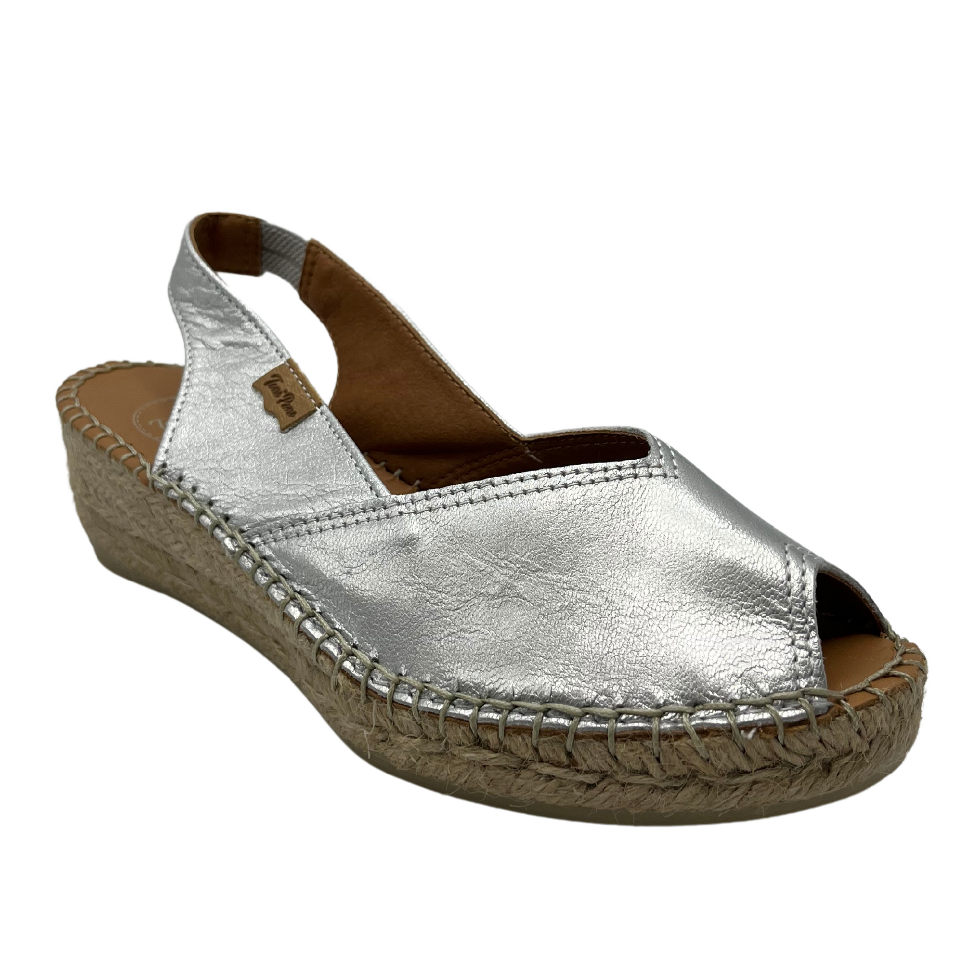 45 degree angled view of silver leather espadrille sandal with peep toe and slingback