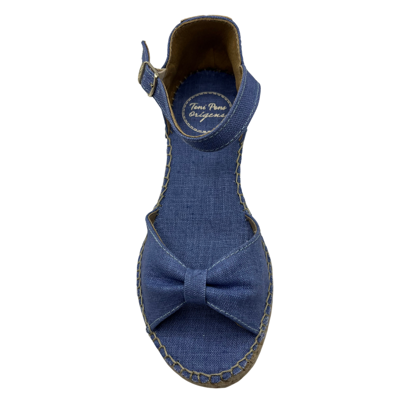 Top view of blue low wedge sandal with bow strap on toe and buckle ankle strap