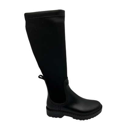 Right facing view of black rubber and lycra tall boot with rounded toe and black rubber outsole