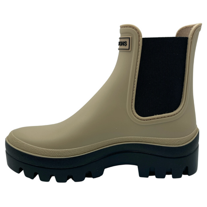 Left facing view of beige rubber chelsea boot with black rubber sole and elastic sides