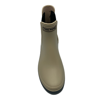 Front view of beige rubber chelsea boot with black rubber sole and elastic sides