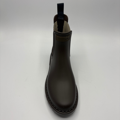 A single dark brown Chelsea rain boot with elastic side gore, a pull tab, photographed against a neutral light gray background.