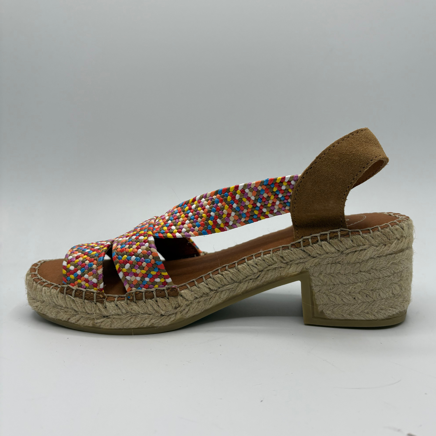 Multicoloured woven sandal with a textured sole on a light gray background