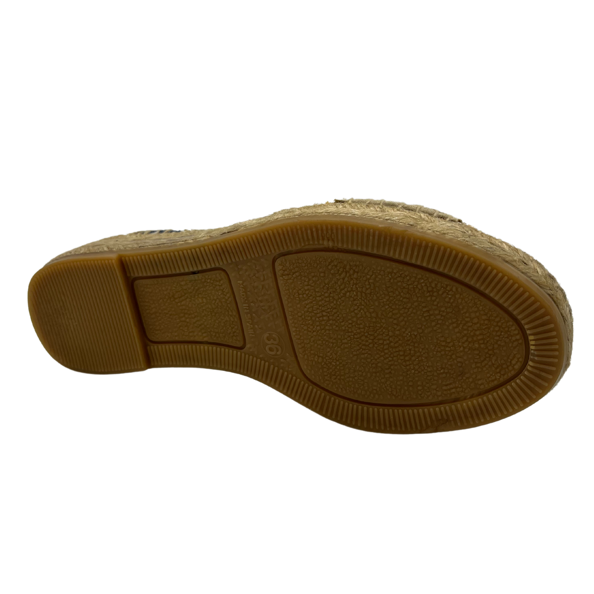 Bottom view of women's espadrille with non-slip rubber bottom and hand stitched details.