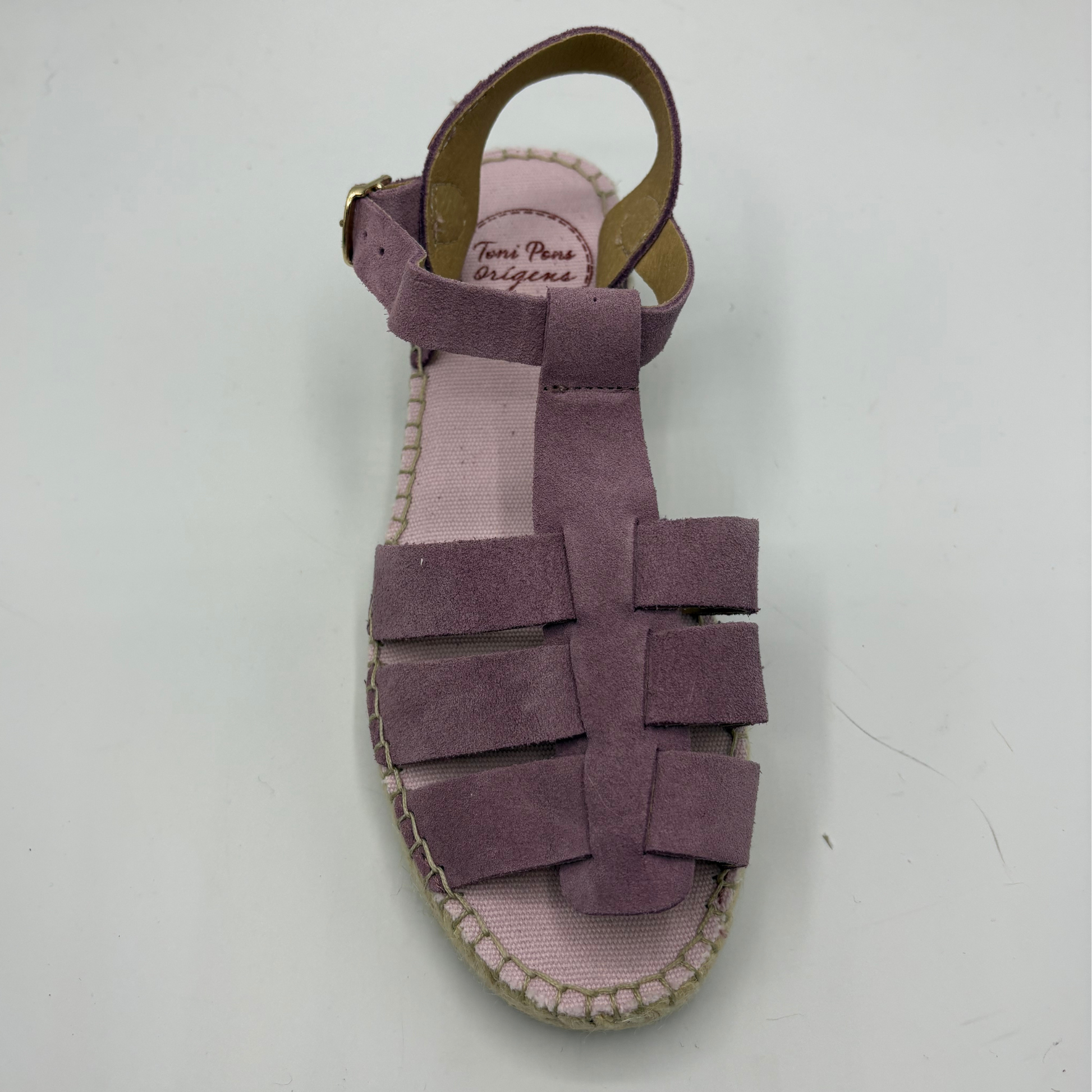 Purple sandal with pink sole on a white background