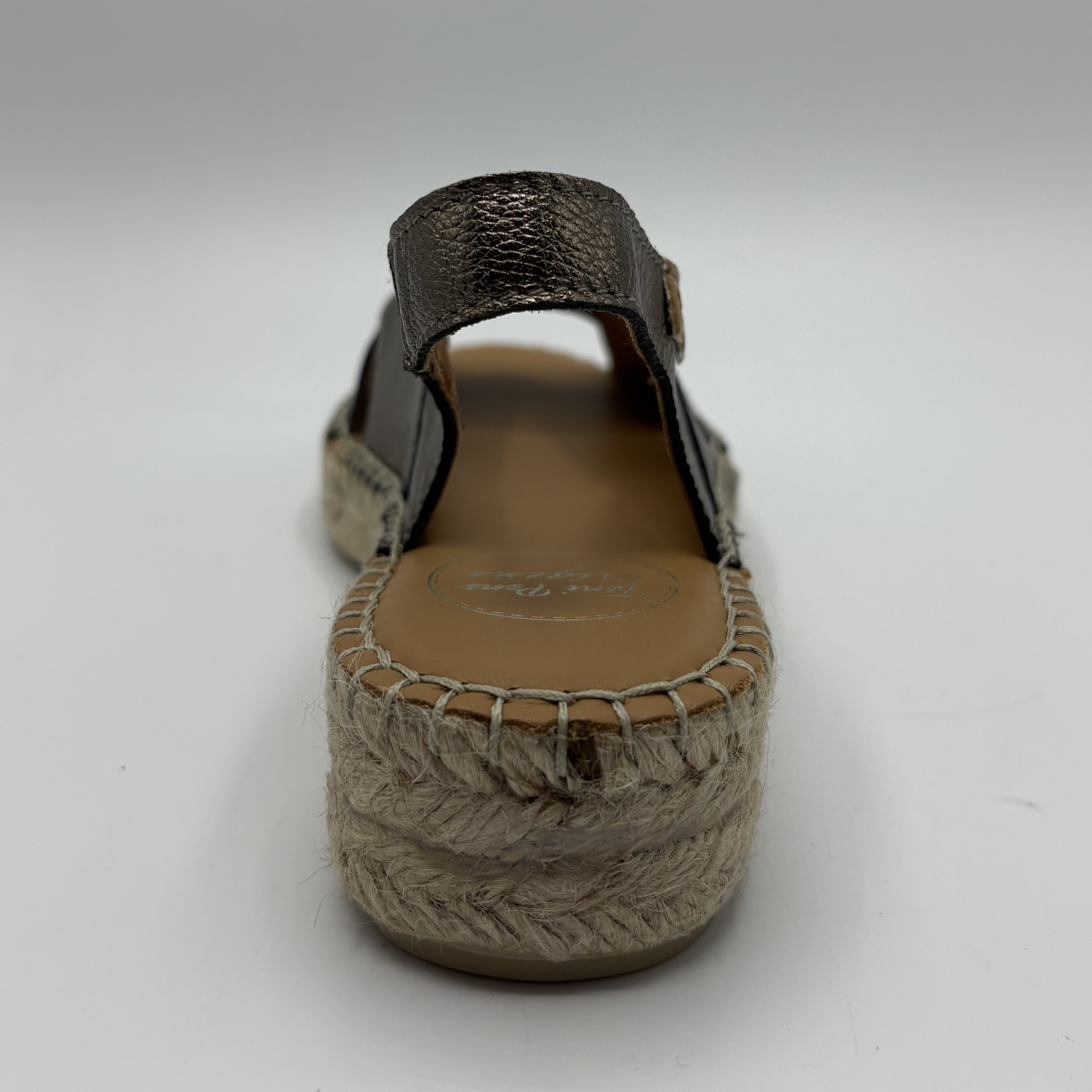 Brown sandal with woven sole on a white background