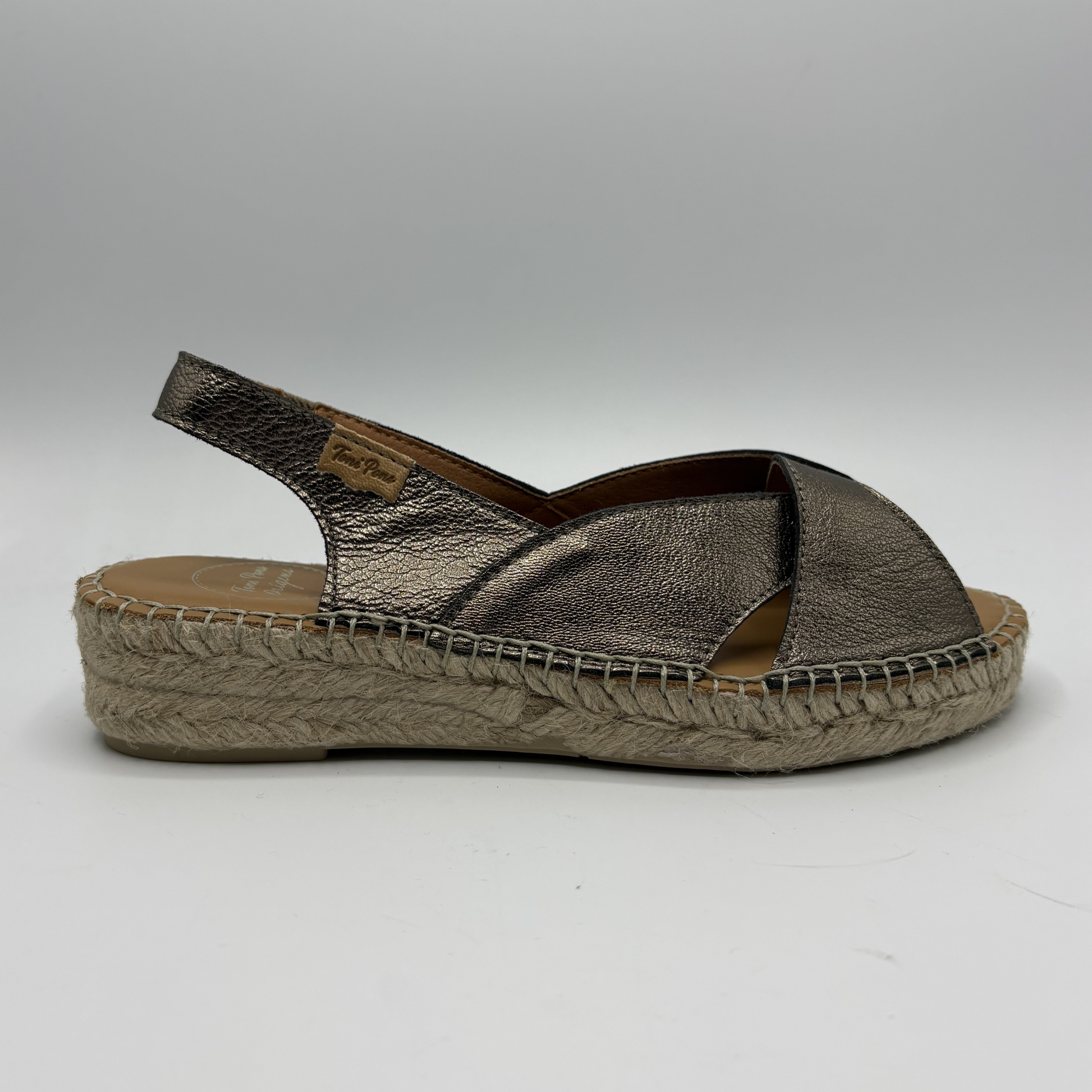 Bronze espadrille sandal on a white background