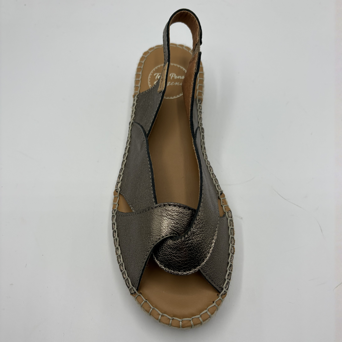 Bronze sandal with brown sole on a white background