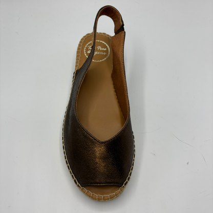 Brown wedge sandal on a white background