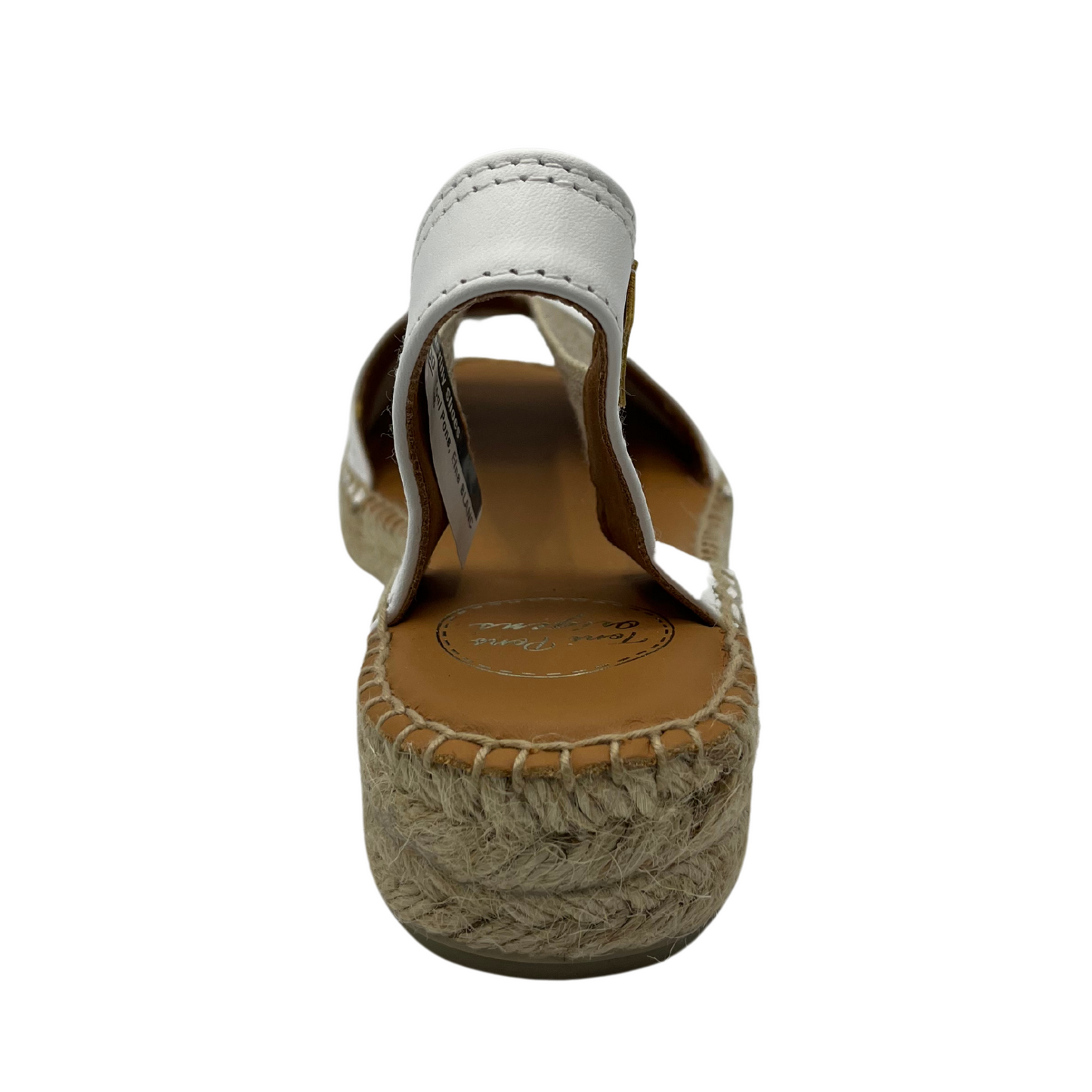 Back view of white leather sandal with brown inner lining and short wedge heel