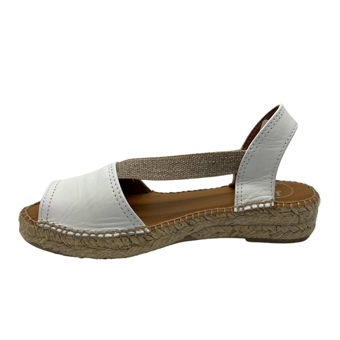 Left facing view of white leather sandal with brown lining and rounded toe