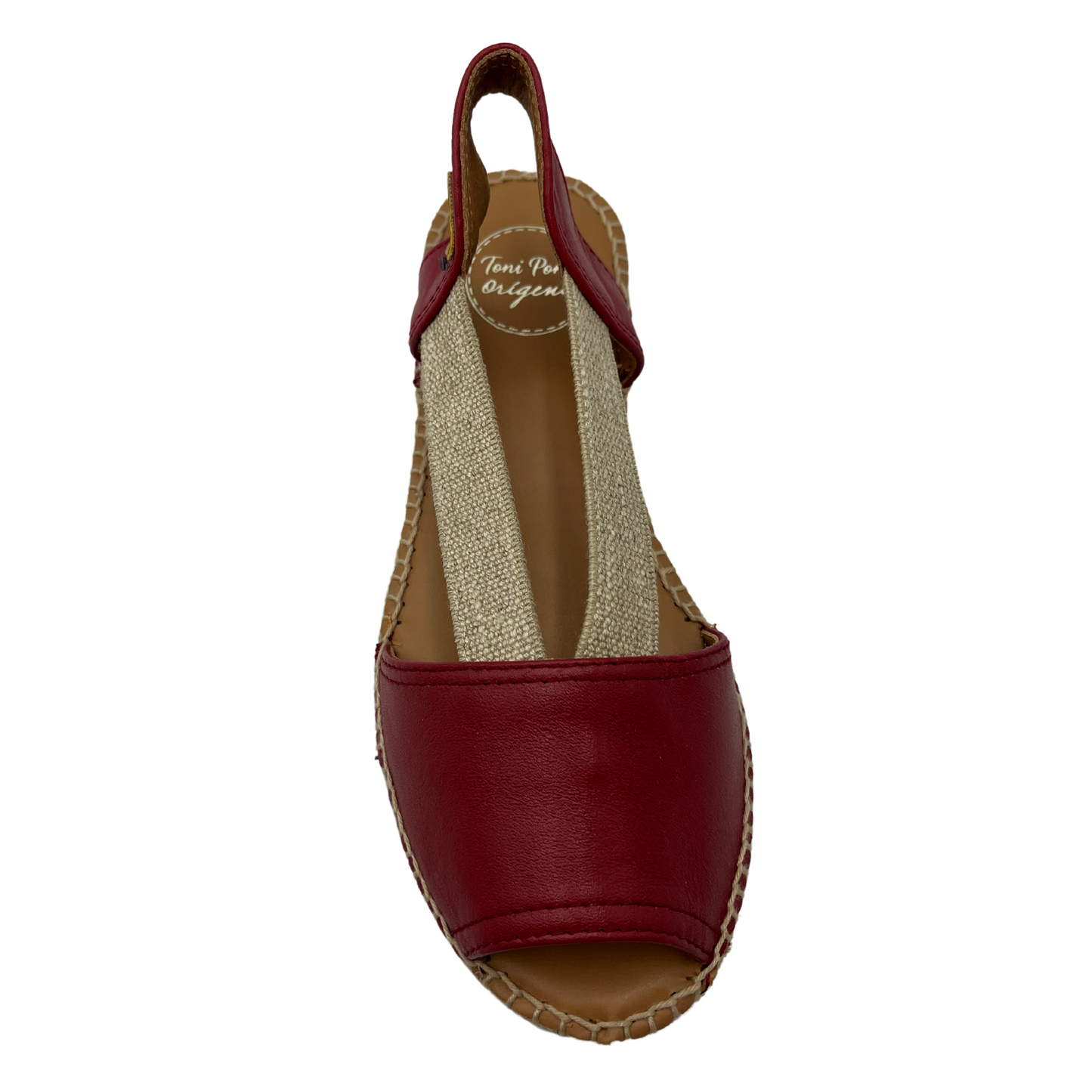 Top view of red leather sandal with brown lining and rounded toe
