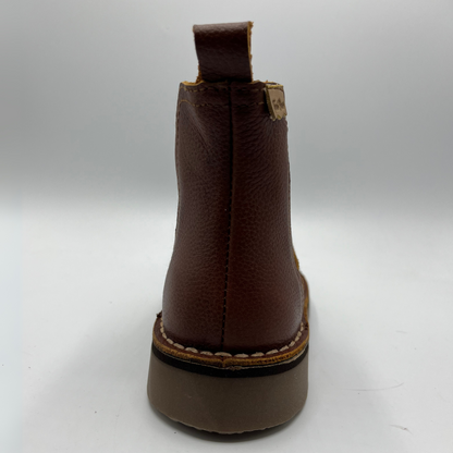 Brown leather boot on a white background