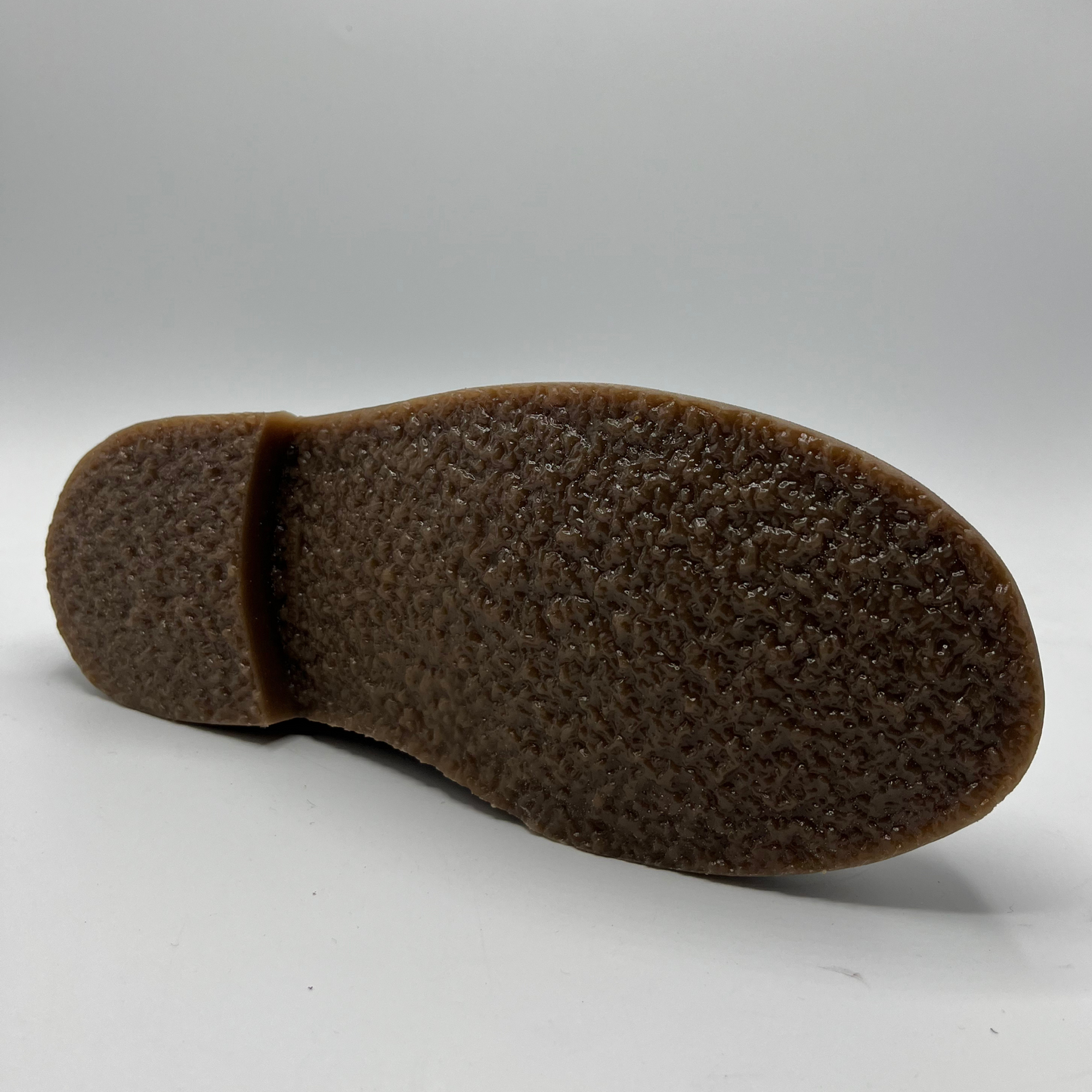 Brown shoe sole on a white background
