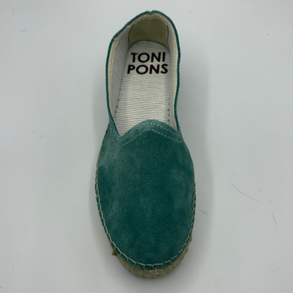 Green espadrille shoe with 'TONI PONS' branding on a white background
