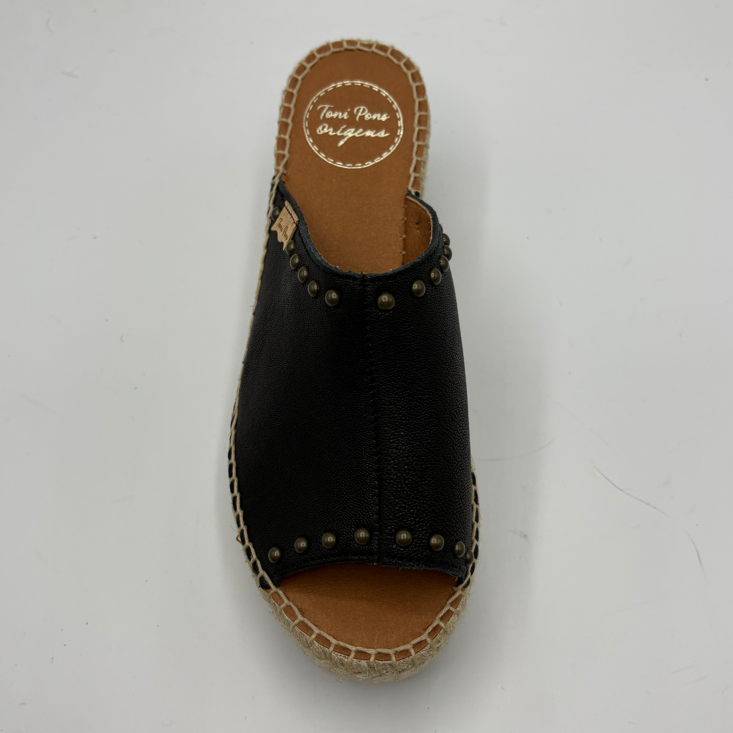 Black sandal with jute sole on a white background