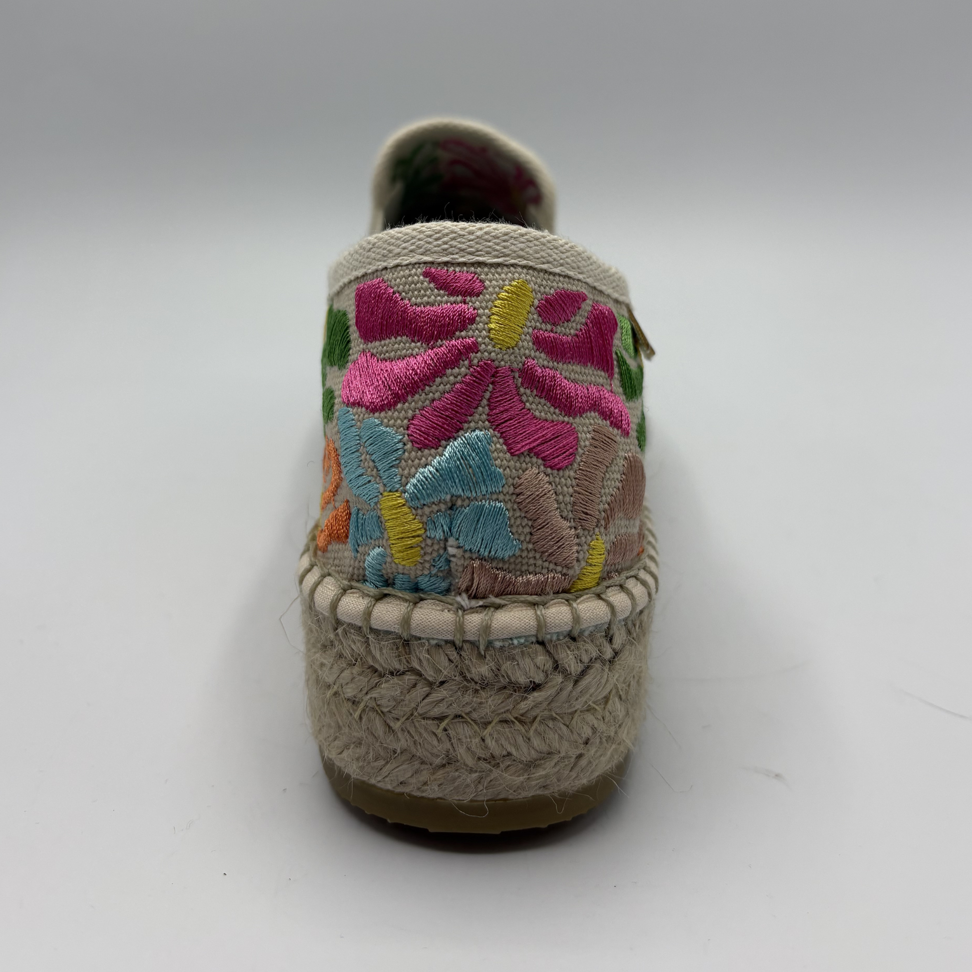Sandal with floral embroidery on a white background