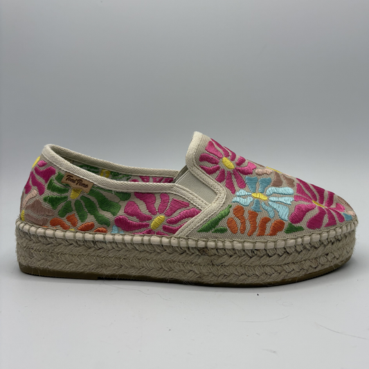 Floral embroidered espadrille shoe on a gray background