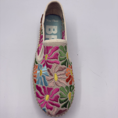 Floral embroidered slip-on shoe on a white background