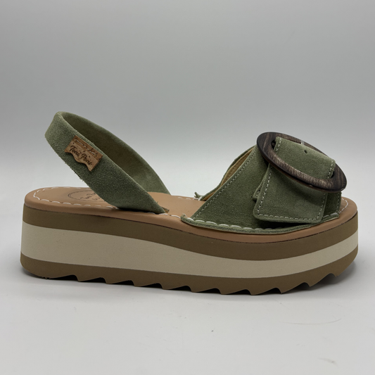 Green sandal with brown platform sole on a white background