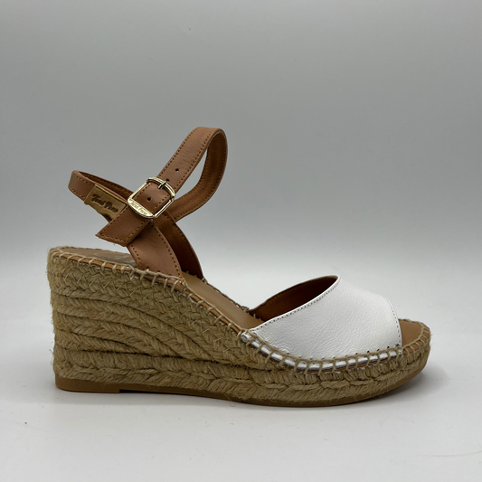 Right facing view of a leather wedge sandal with a peep toe and adjustable ankle strap.