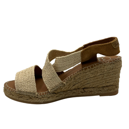 Left facing view of wedge heel shoe with suede slingback strap and crossover straps