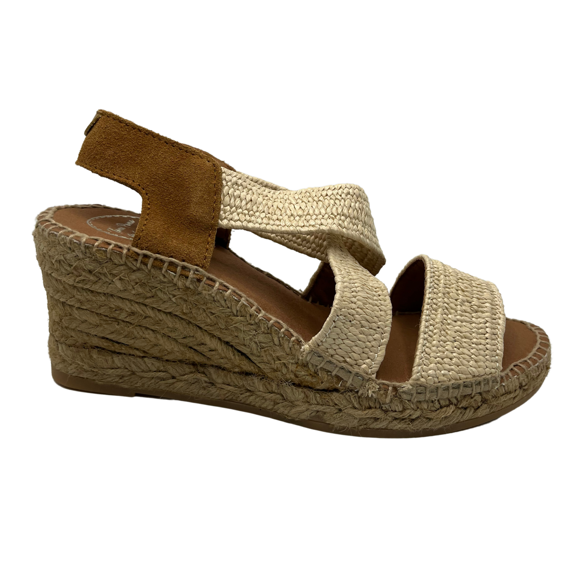 Right facing view of wedge heel with cross over straps and suede sling back strap